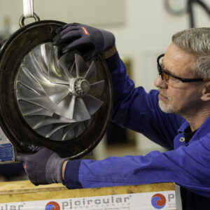 Service engineer putting a turbocharger in a box